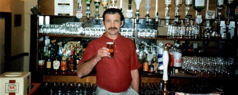 Leon Bonds behind the bar of the Farnham George