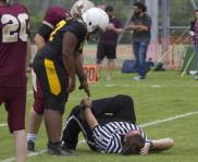 A large person has stepped on the ref's foot