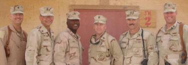 Andy Gray on the far left outside home in Iraq